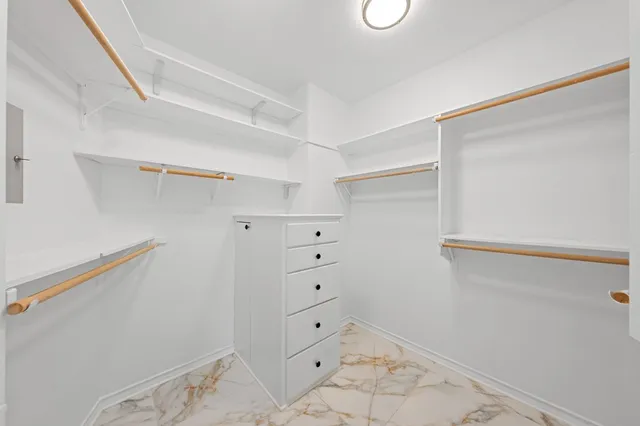 a view of a storage and utility room with closet