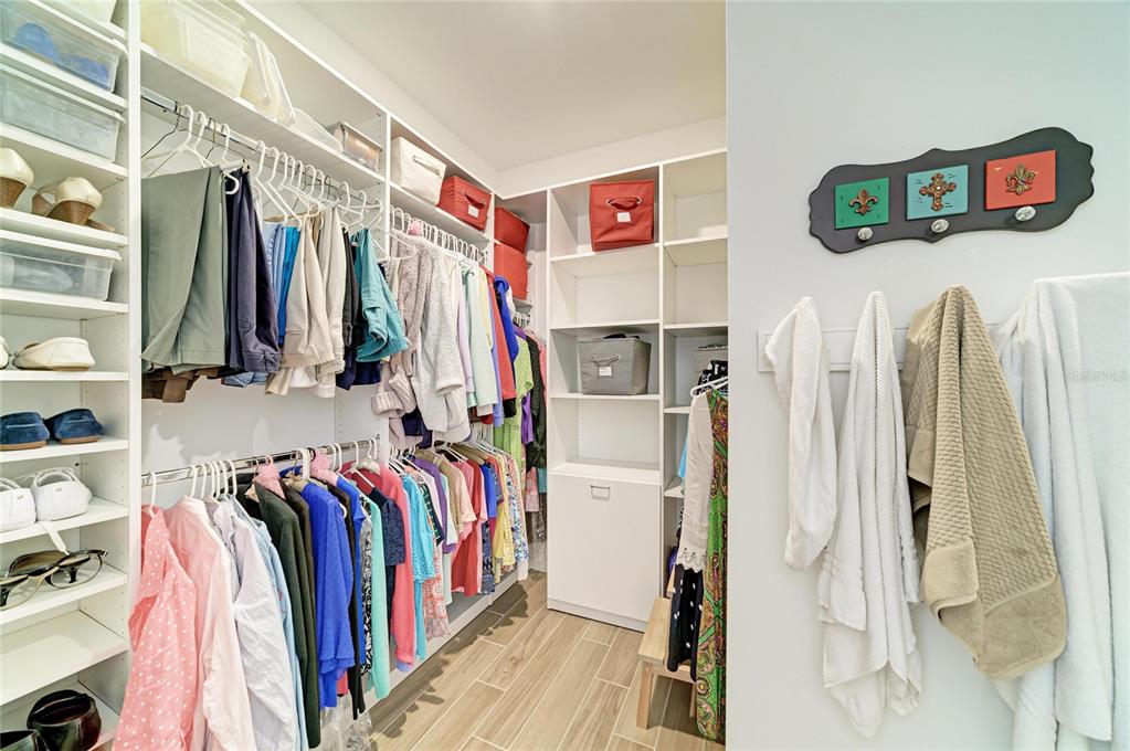 16341 Hidden Oak Loop Lakewood Ranch, FL 34211 - Photo 29 of 76 a view of walk in closet with clothes and shoes