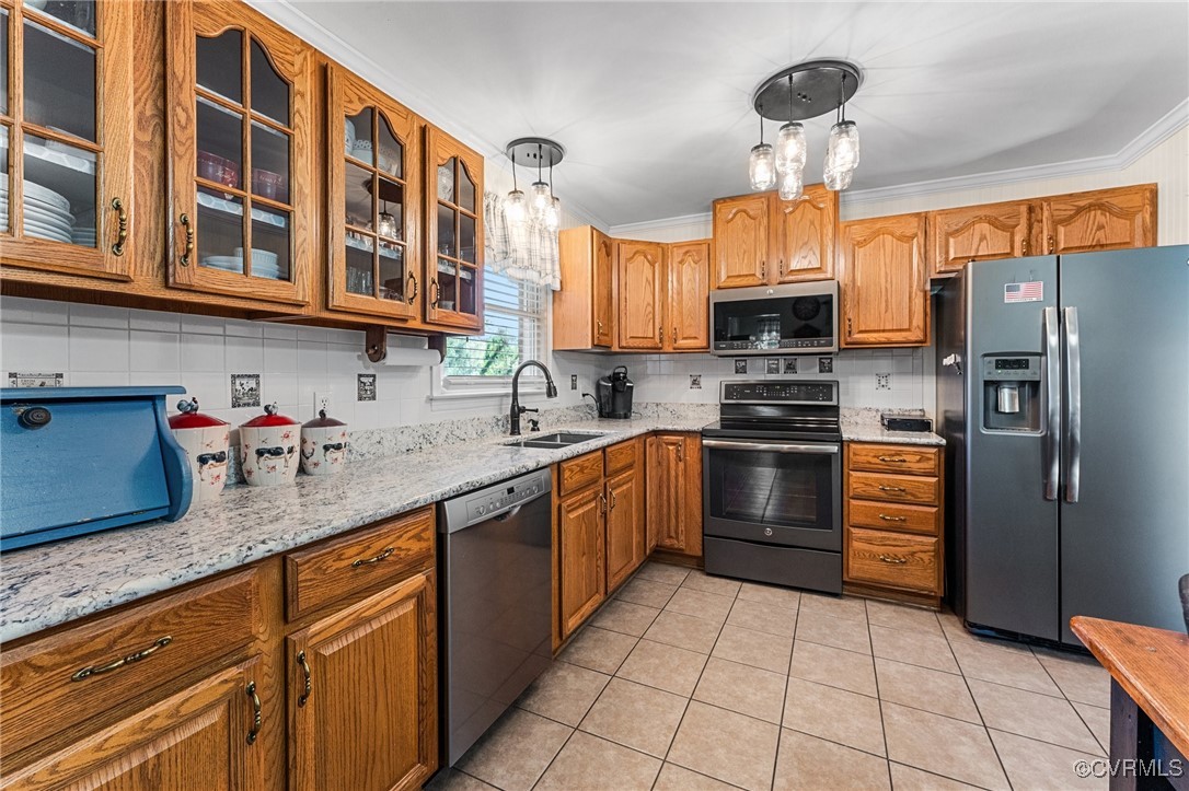 5428 West Hundred Road Chester, VA 23831 - Photo 38 of 48 a kitchen with stainless steel appliances granite countertop a sink stove and refrigerator
