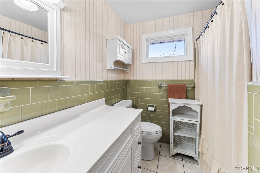 5428 West Hundred Road Chester, VA 23831 - Photo 8 of 48 a bathroom with a sink toilet and window
