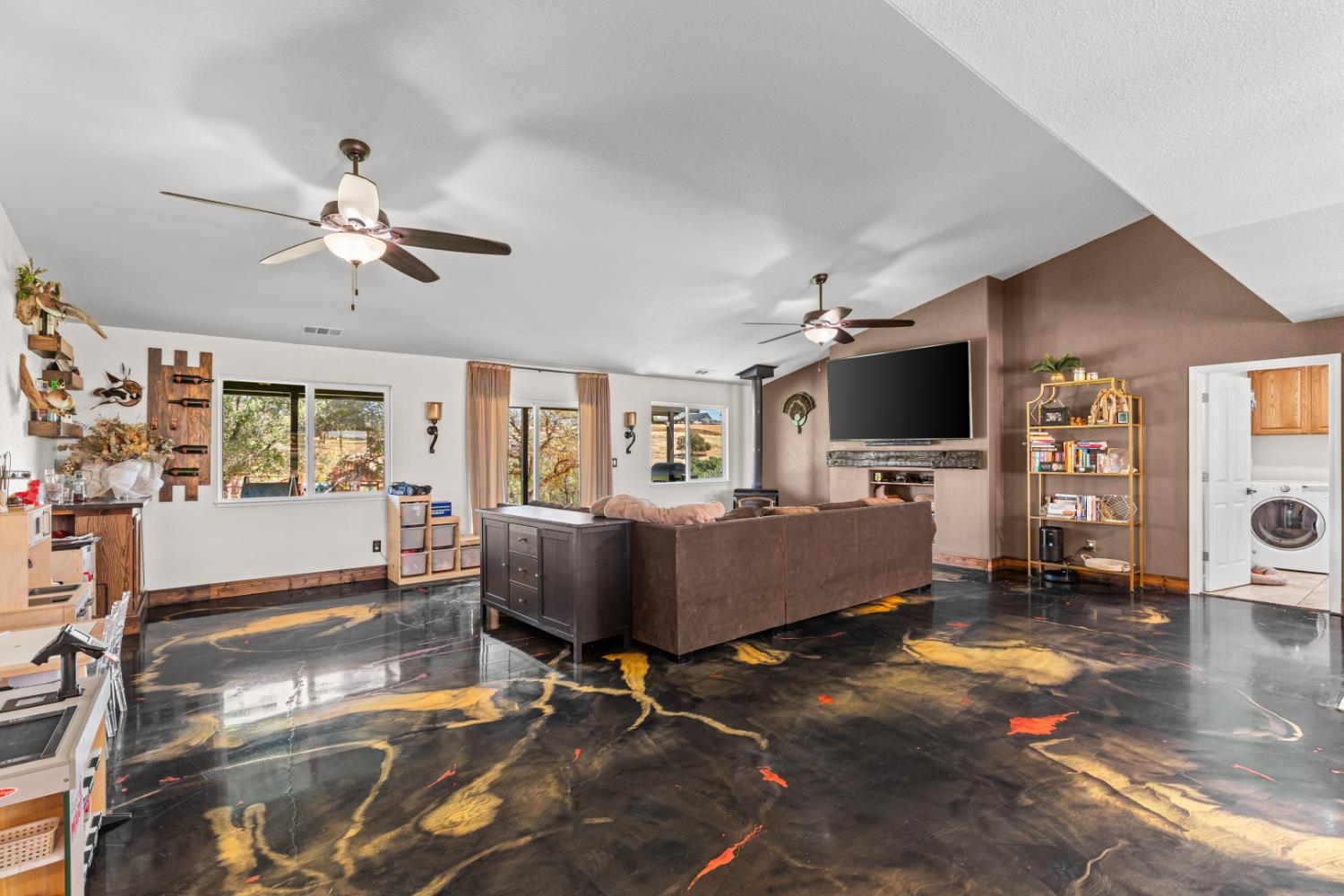 2384 Choctaw Road Copperopolis, CA 95228 - Photo 22 of 53 a living room with furniture and a flat screen tv