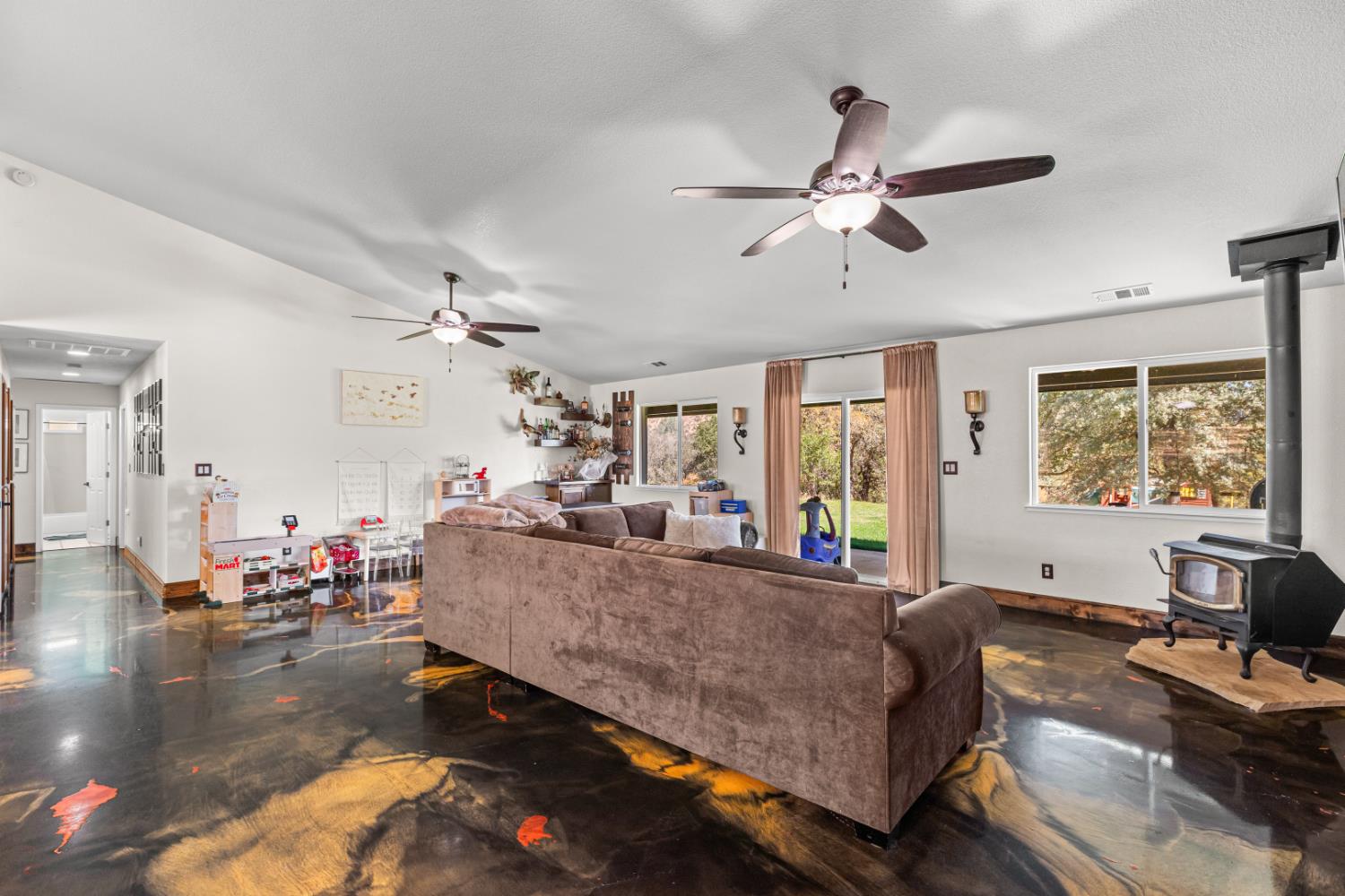 2384 Choctaw Road Copperopolis, CA 95228 - Photo 24 of 53 a living room with furniture and a flat screen tv