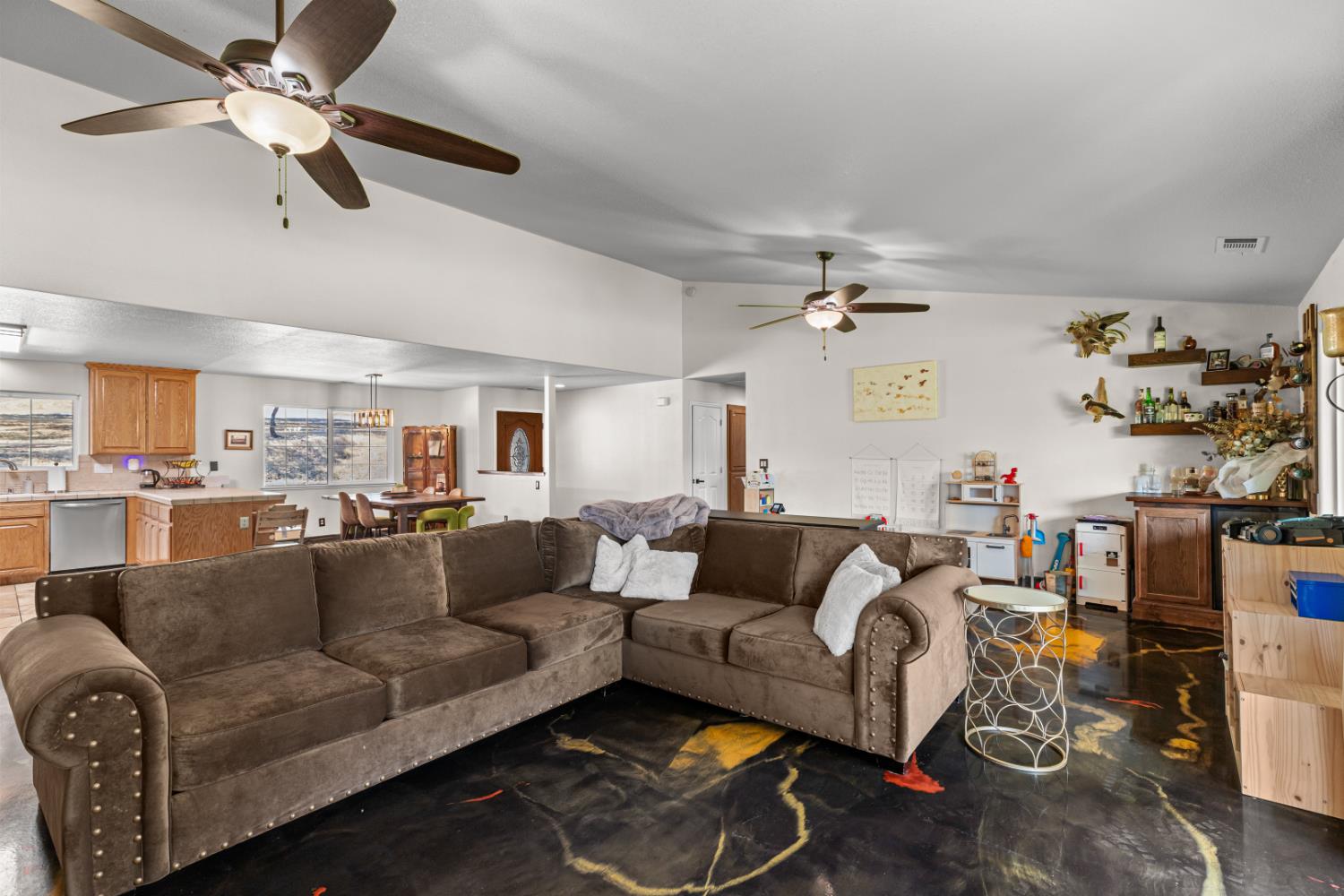 2384 Choctaw Road Copperopolis, CA 95228 - Photo 25 of 53 a living room with furniture and a chandelier