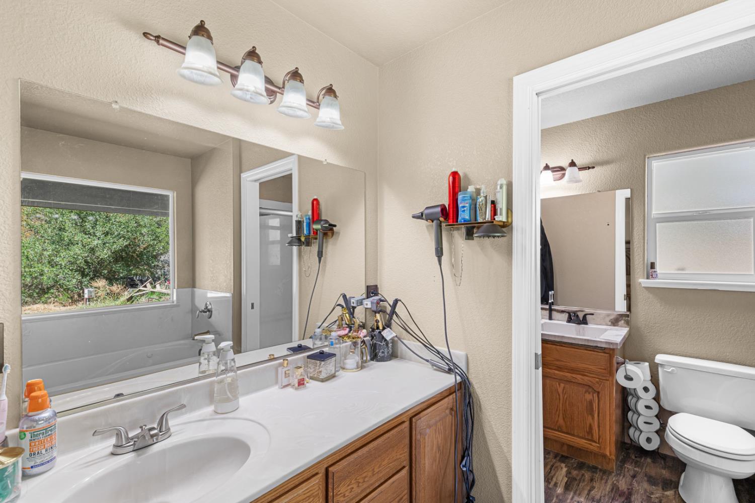2384 Choctaw Road Copperopolis, CA 95228 - Photo 38 of 53 a bathroom with a sink double vanity granite and a toilet