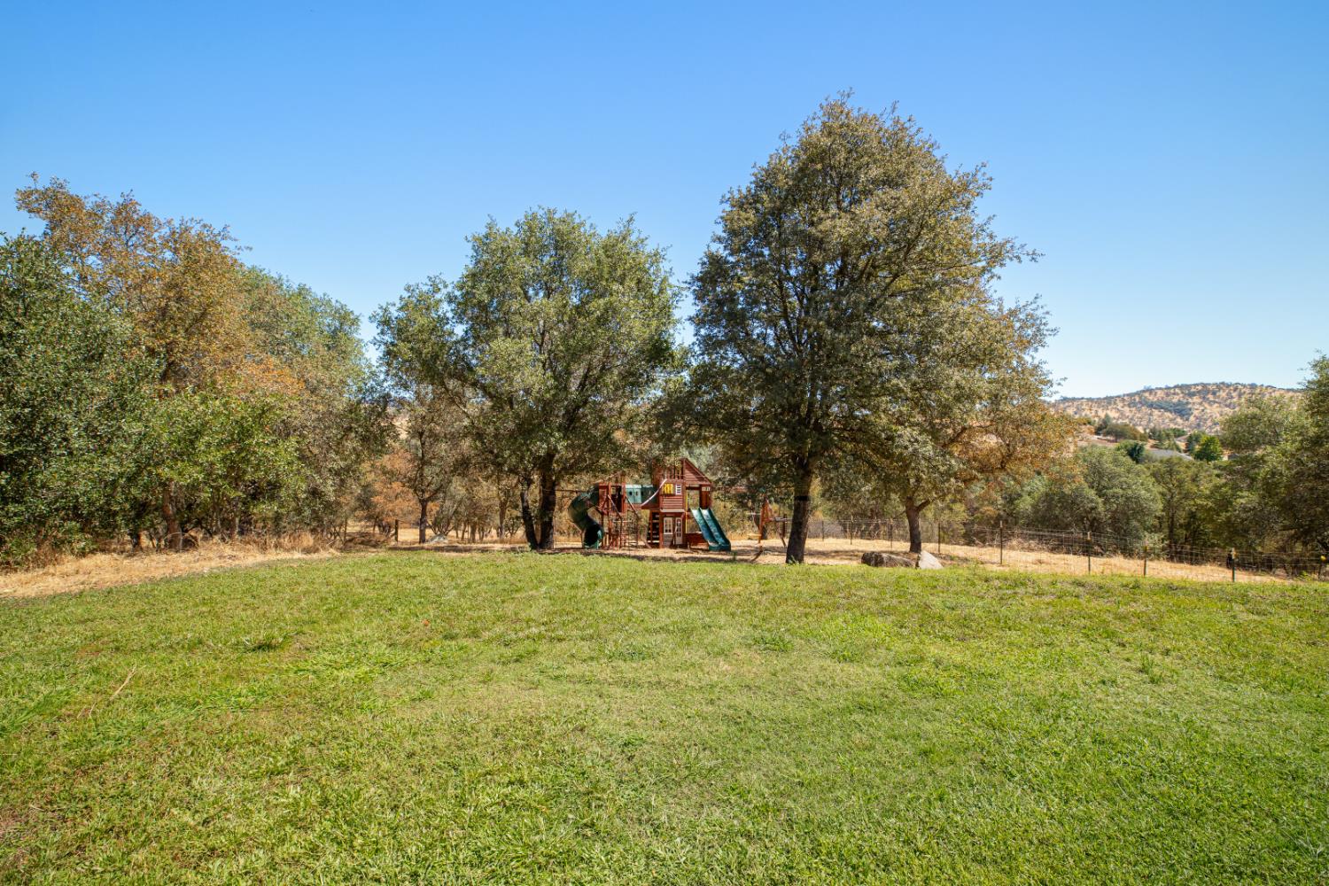2384 Choctaw Road Copperopolis, CA 95228 - Photo 42 of 53 a view of a field with trees in the background