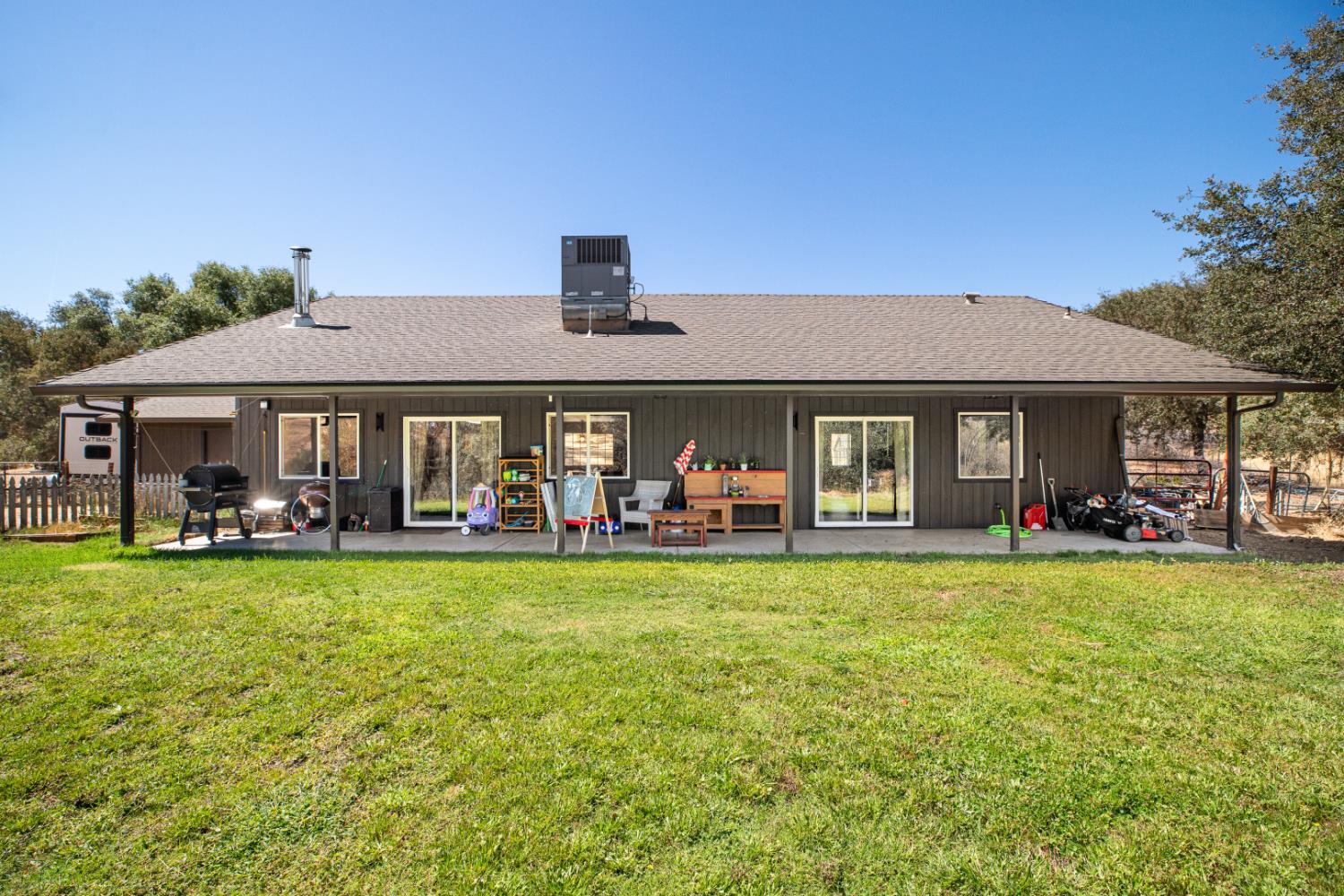 2384 Choctaw Road Copperopolis, CA 95228 - Photo 46 of 53 a front view of a house with swimming pool having outdoor seating