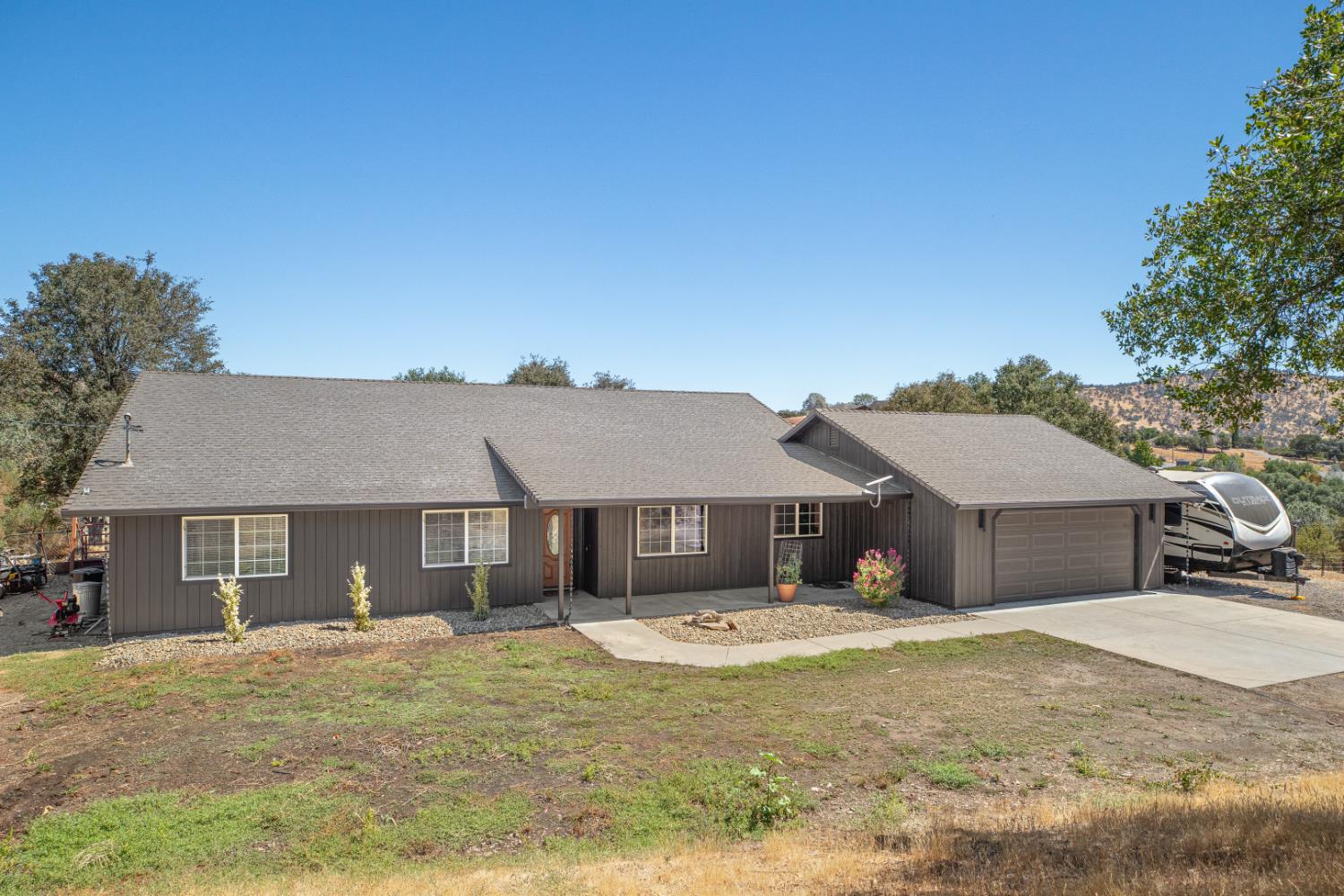 2384 Choctaw Road Copperopolis, CA 95228 - Photo 10 of 53 a front view of a house with a yard and garage