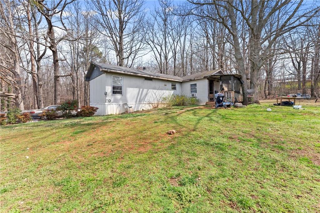 111 Skitts Mountain Road Cleveland, GA 30528 - Photo 14 of 60 a house that has a tree in front of it