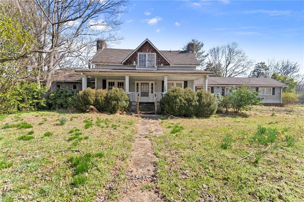 111 Skitts Mountain Road Cleveland, GA 30528 - Photo 22 of 60 a front view of a house with a yard