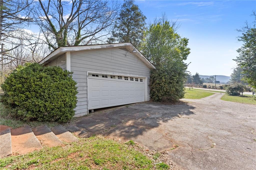 111 Skitts Mountain Road Cleveland, GA 30528 - Photo 23 of 60 a view of a house with a yard and large tree