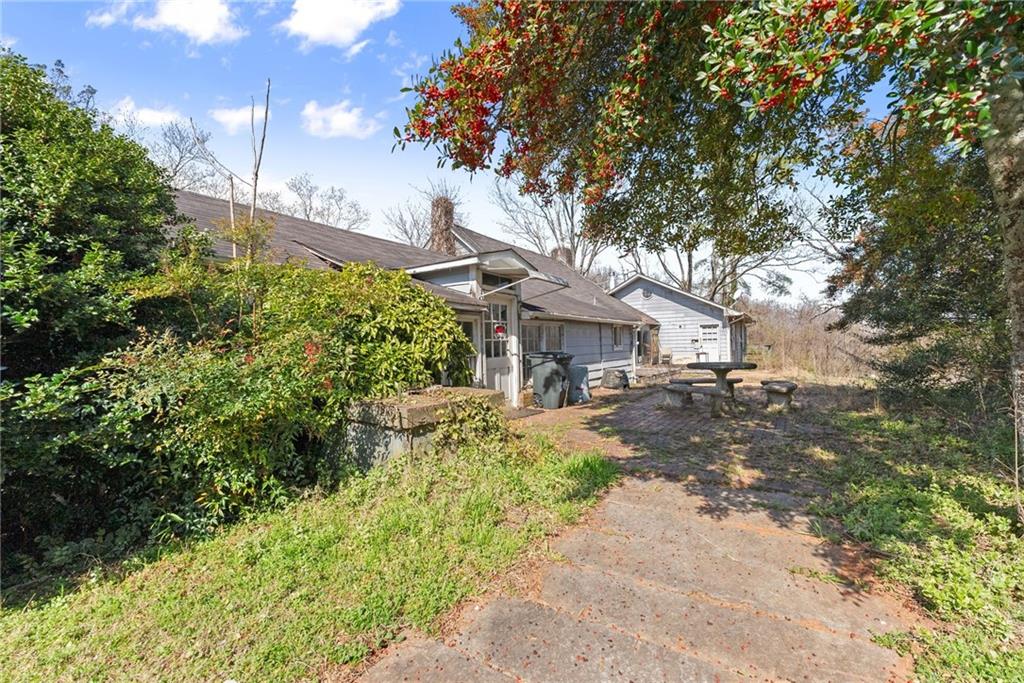 111 Skitts Mountain Road Cleveland, GA 30528 - Photo 24 of 60 a front view of a house with a yard and fountain