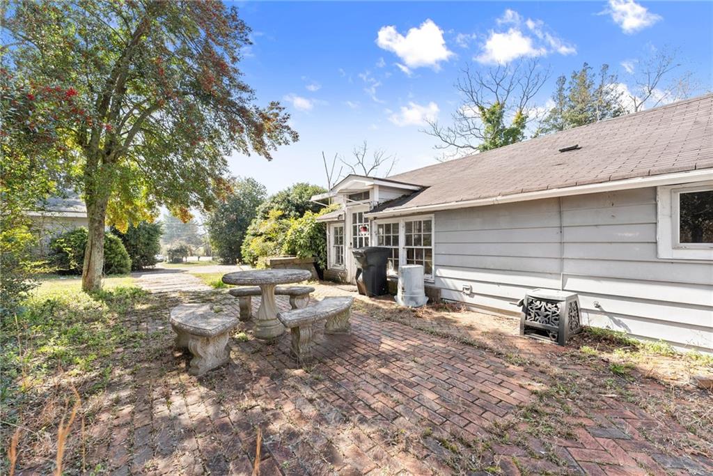 111 Skitts Mountain Road Cleveland, GA 30528 - Photo 25 of 60 a view of a backyard with large trees