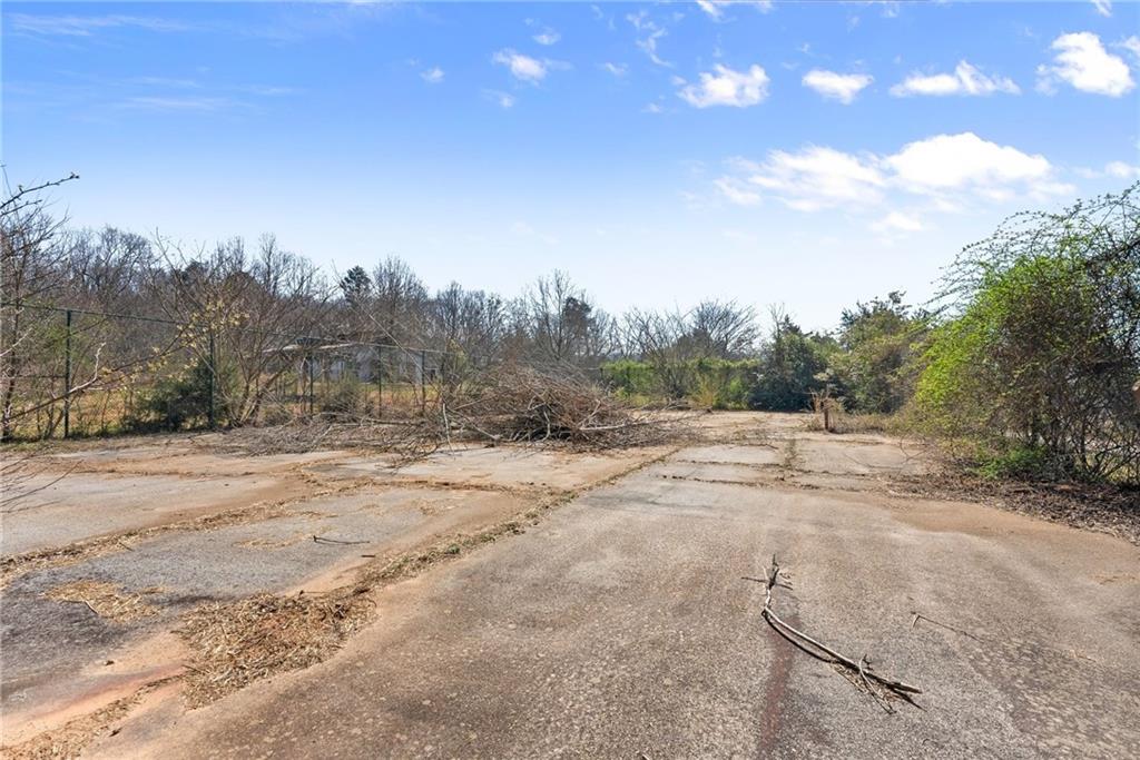 111 Skitts Mountain Road Cleveland, GA 30528 - Photo 31 of 60 a view of a dirt road with trees in the background