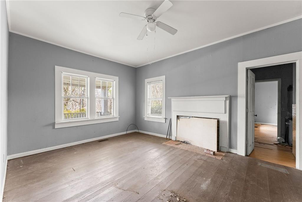 111 Skitts Mountain Road Cleveland, GA 30528 - Photo 43 of 60 a view of empty room with a fireplace and window