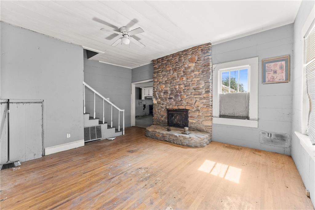 111 Skitts Mountain Road Cleveland, GA 30528 - Photo 44 of 60 a view of empty room with fireplace and fan