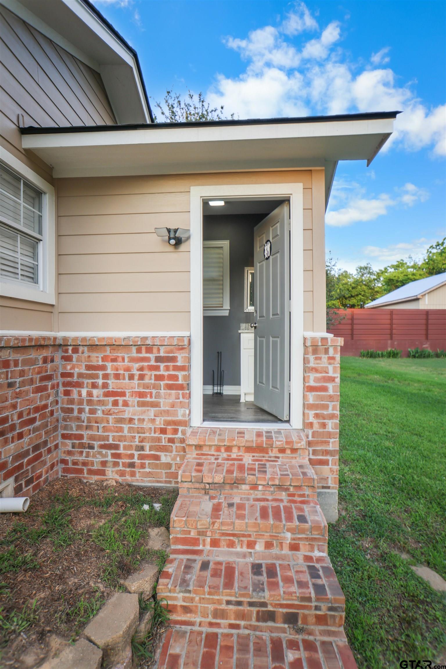 11931 State Highway 64 Tyler, TX 75704 - Photo 42 of 44 a view of a brick house with a large window