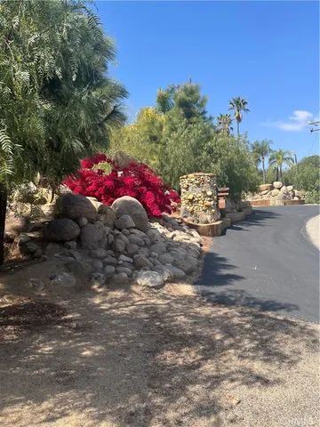 a bedroom with a bed and lamp