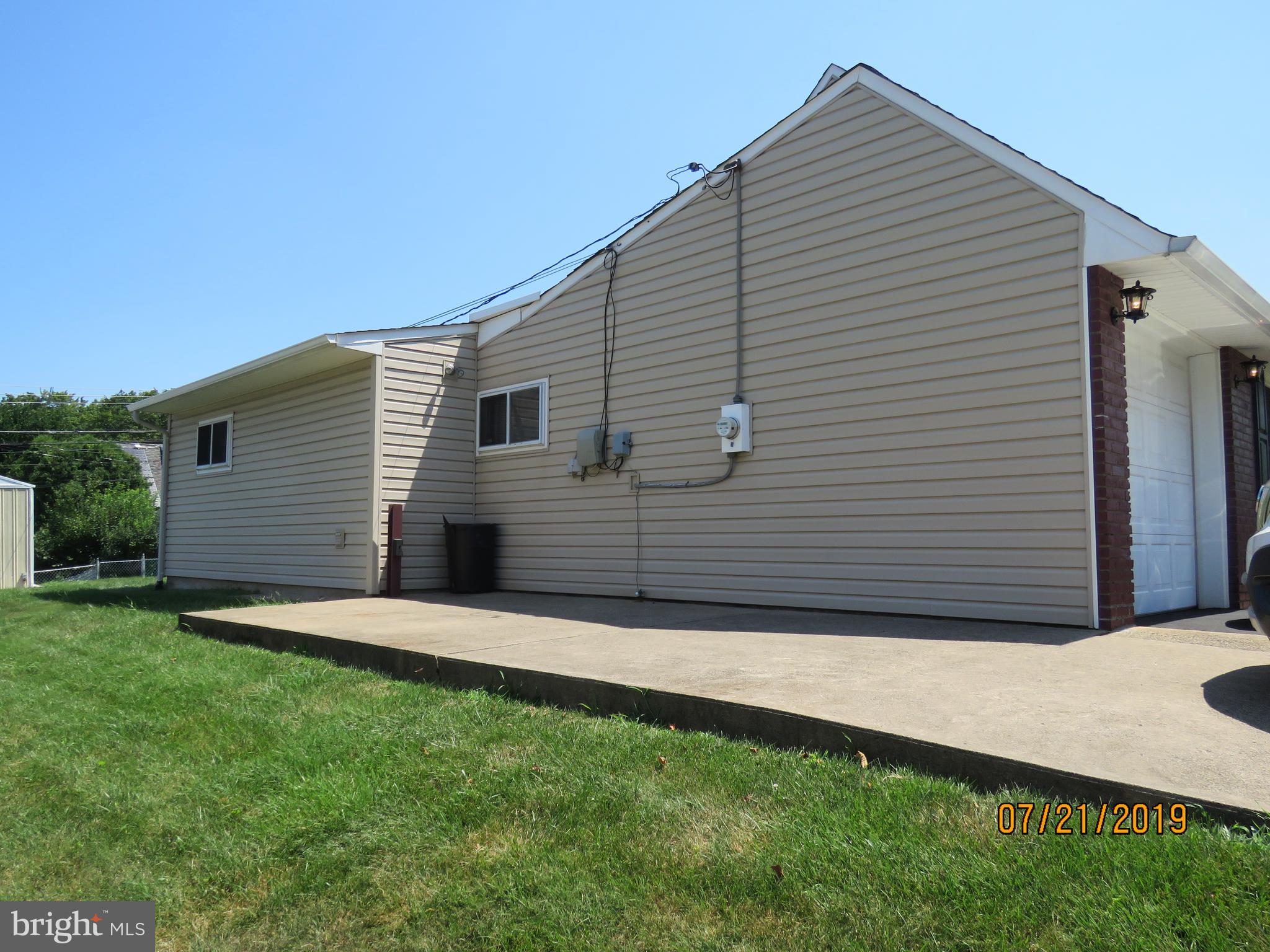 50 Quail Road Levittown, PA 19057 - Photo 15 of 18 Side view with extended concrete driveway
