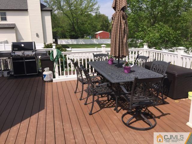 35 Butcher Road Monroe Township, NJ 08831 - Photo 22 of 25 a view of a dinning table and chairs on the roof deck
