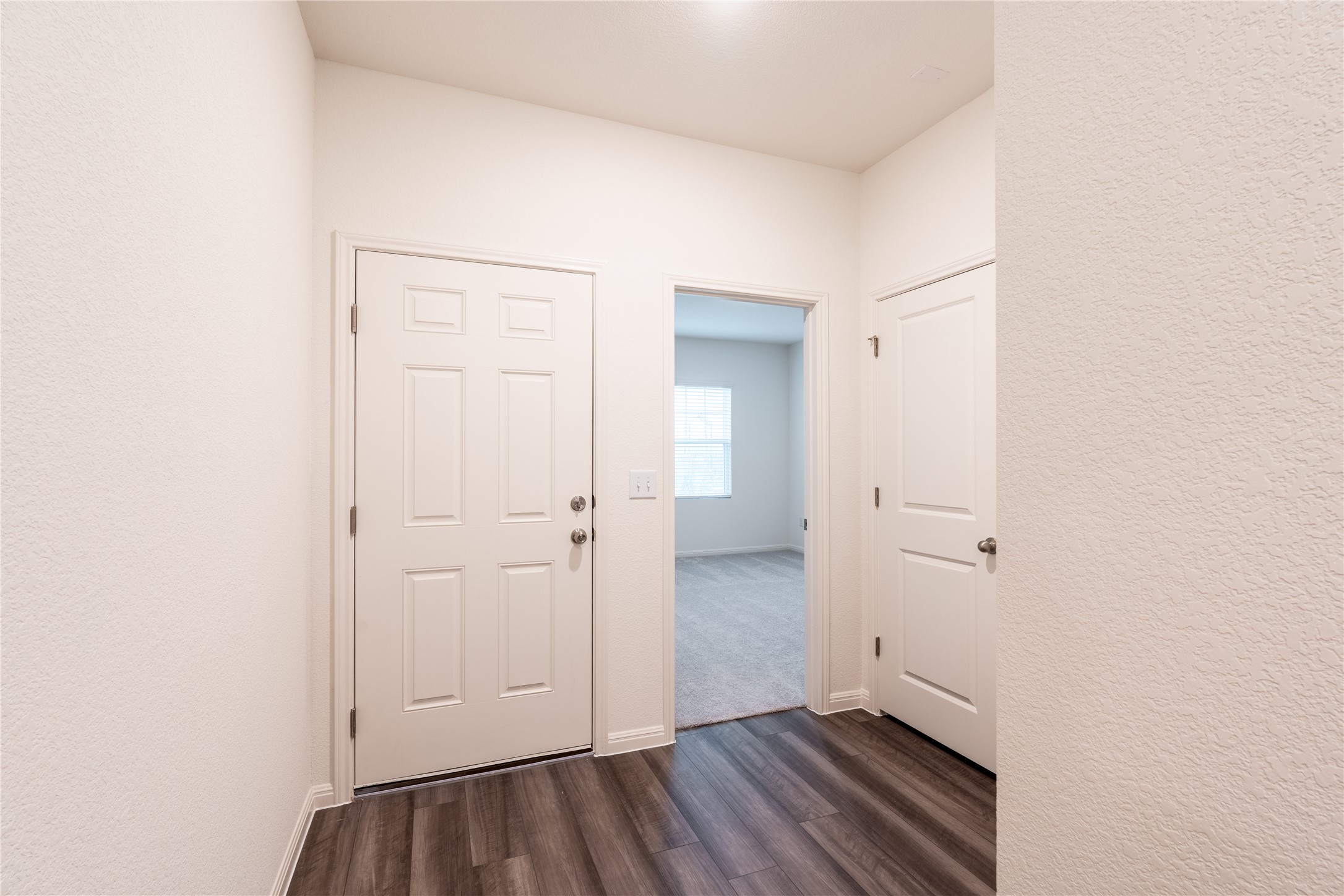 144 Mullen Way Taylor, TX 76574 - Photo 13 of 26 an empty room with wooden floor
