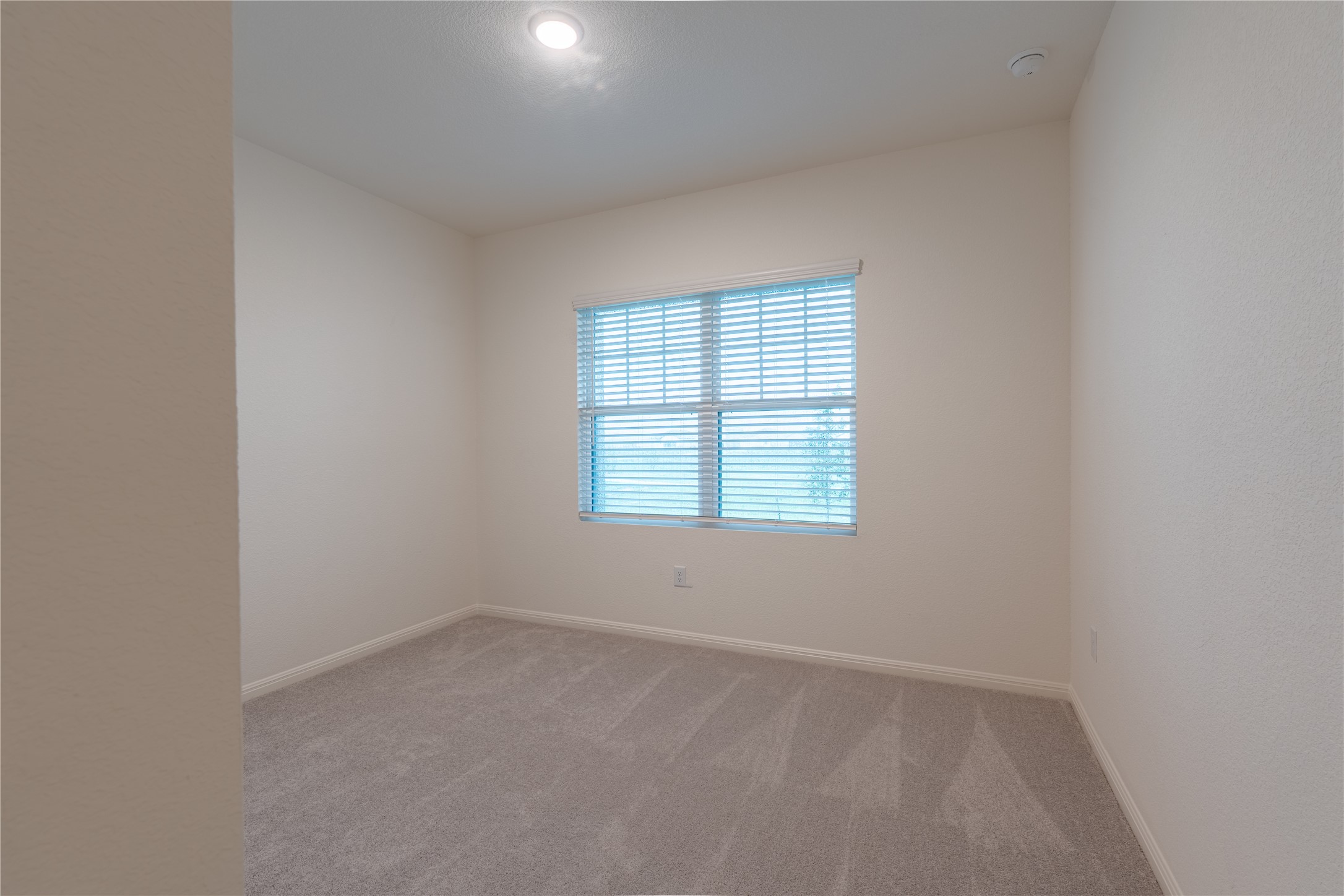 144 Mullen Way Taylor, TX 76574 - Photo 16 of 26 an empty room with a window