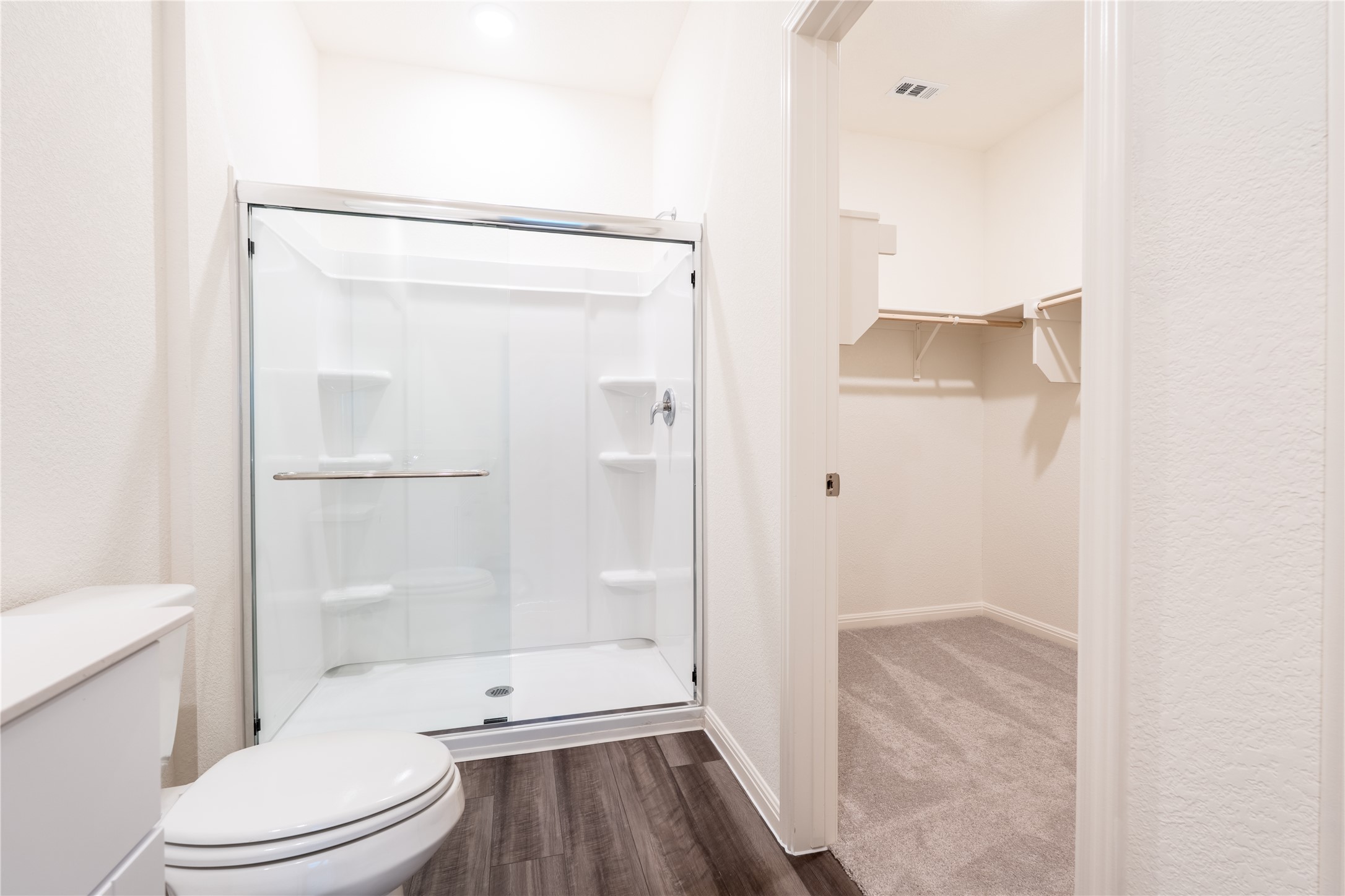 144 Mullen Way Taylor, TX 76574 - Photo 23 of 26 a bathroom with a toilet and a shower