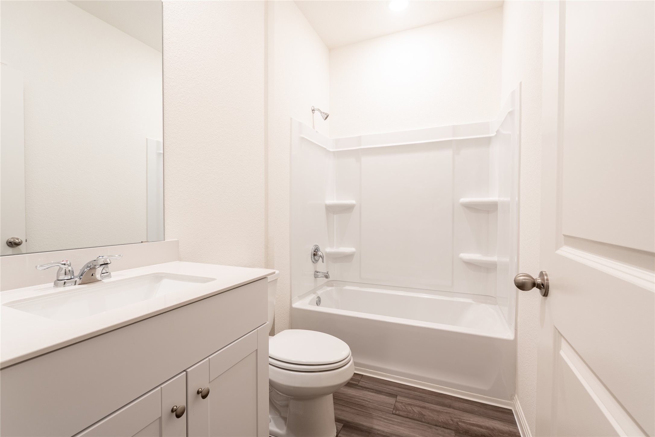 144 Mullen Way Taylor, TX 76574 - Photo 24 of 26 a bathroom with a sink a toilet and a bathtub