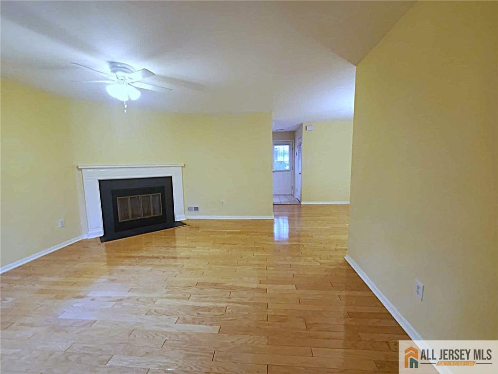 38 Rutland Lane, Unit 38A Monroe Township, NJ 08831 - Photo 4 of 19 a view of empty room with a fireplace