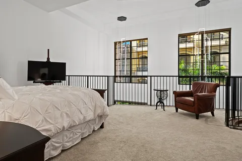 a bed room with a bed and a television