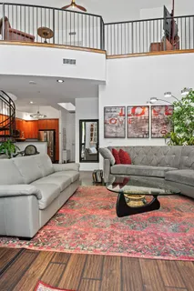 a living room with furniture and a rug