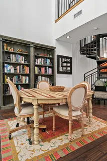 a work room with furniture and book shelf