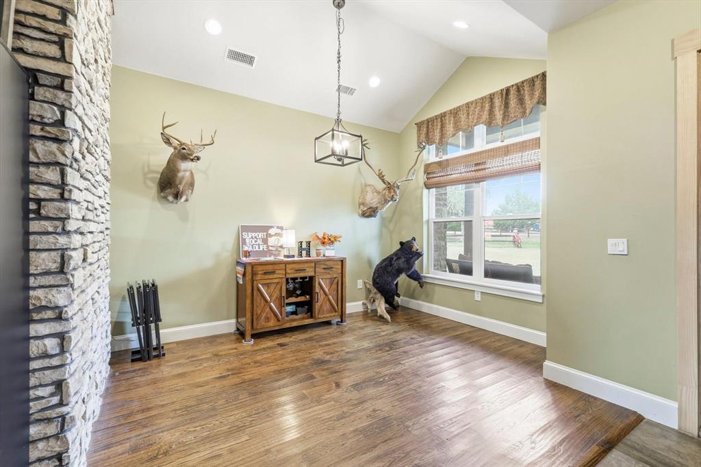 3300 Rigsby Lane Celina, TX 75009 - Photo 6 of 40 Dining area featuring wood finished floors and high vaulted ceiling