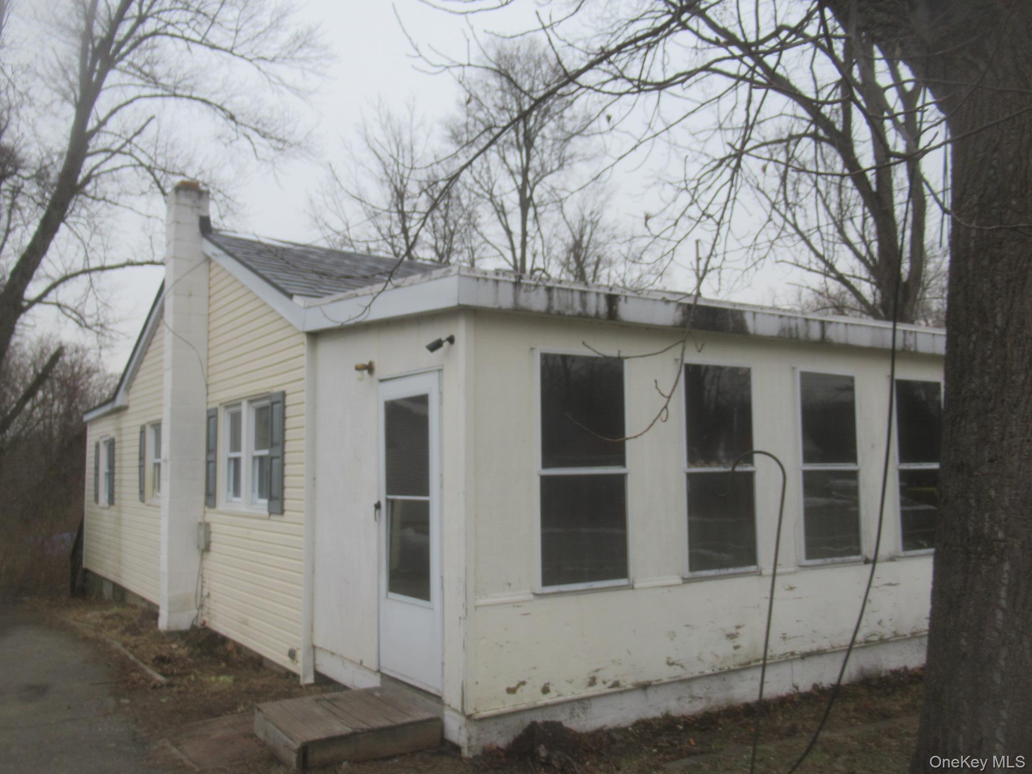 162 Osborne Hill Road Fishkill, NY 12524 - Photo 2 of 11 a house with white door of a house