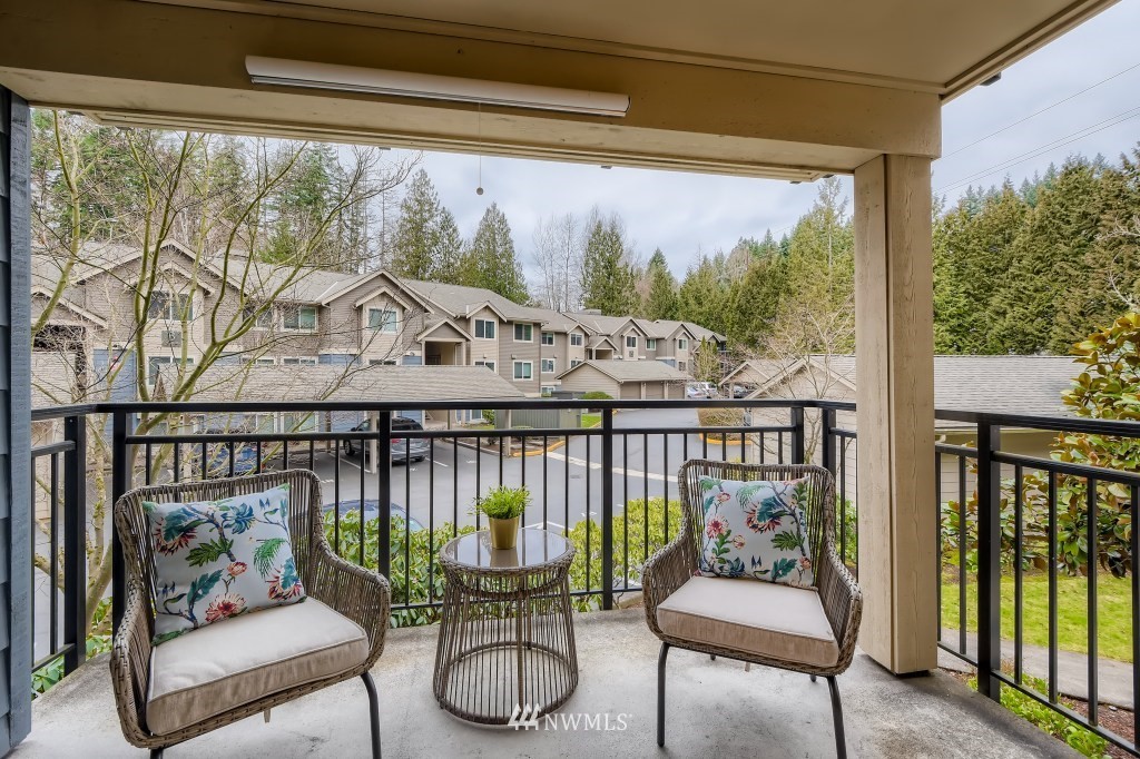 19410 Bothell Way Northeast, Unit D202 Bothell, WA 98011 - Photo 11 of 26 a living room with furniture and a floor to ceiling window