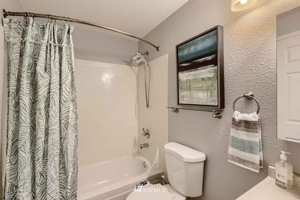19410 Bothell Way Northeast, Unit D202 Bothell, WA 98011 - Photo 16 of 26 a bathroom with a shower a toilet and a sink