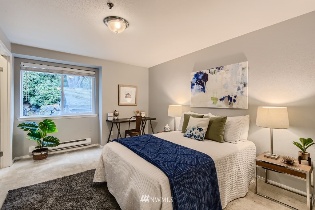 19410 Bothell Way Northeast, Unit D202 Bothell, WA 98011 - Photo 17 of 26 a bedroom with a bed and a large window