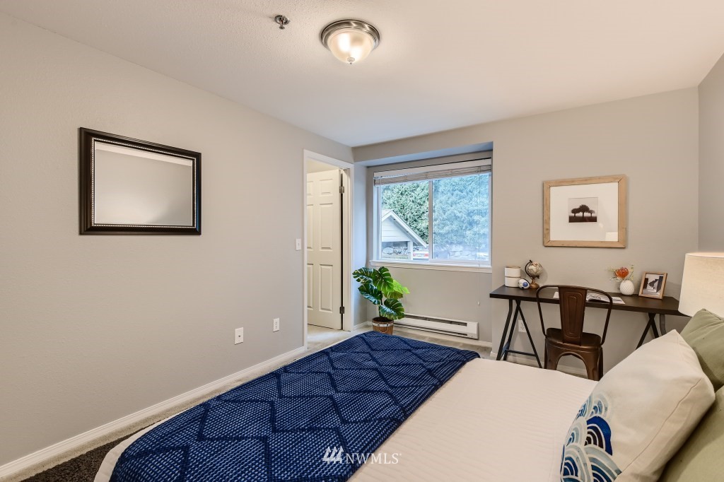 19410 Bothell Way Northeast, Unit D202 Bothell, WA 98011 - Photo 18 of 26 a living room with furniture and a window