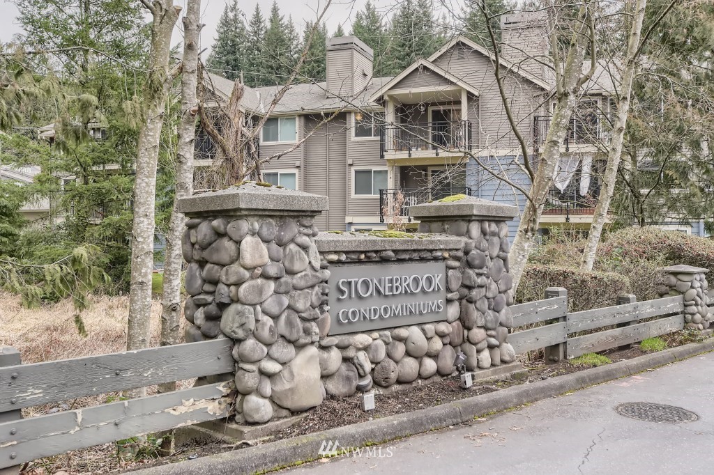 19410 Bothell Way Northeast, Unit D202 Bothell, WA 98011 - Photo 2 of 26 a front view of a house with a tree