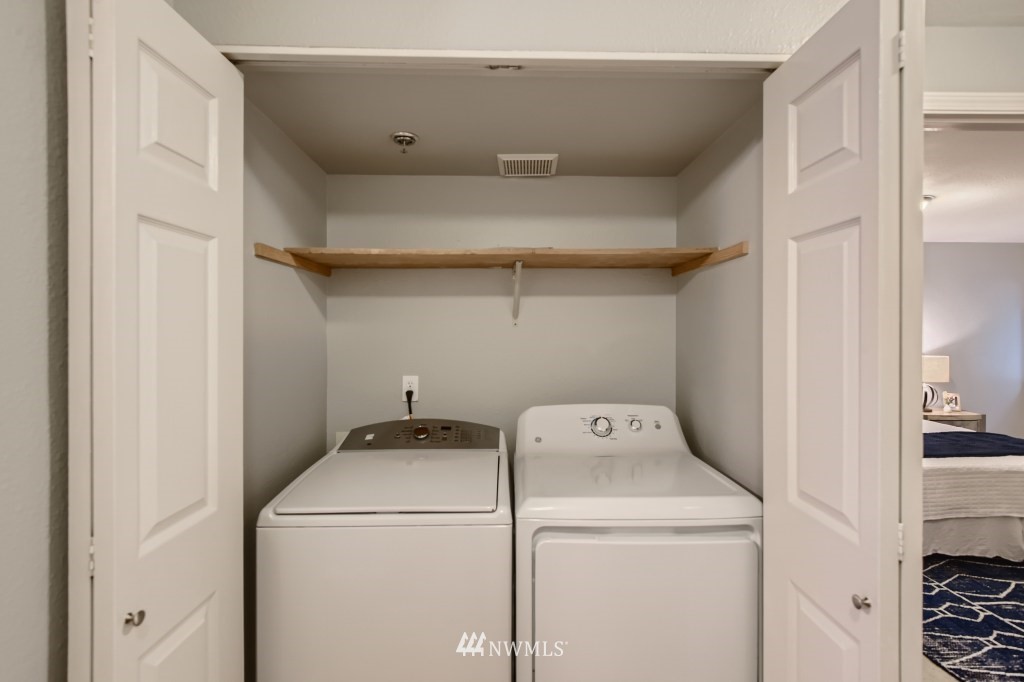 19410 Bothell Way Northeast, Unit D202 Bothell, WA 98011 - Photo 23 of 26 a utility room with dryer and washer