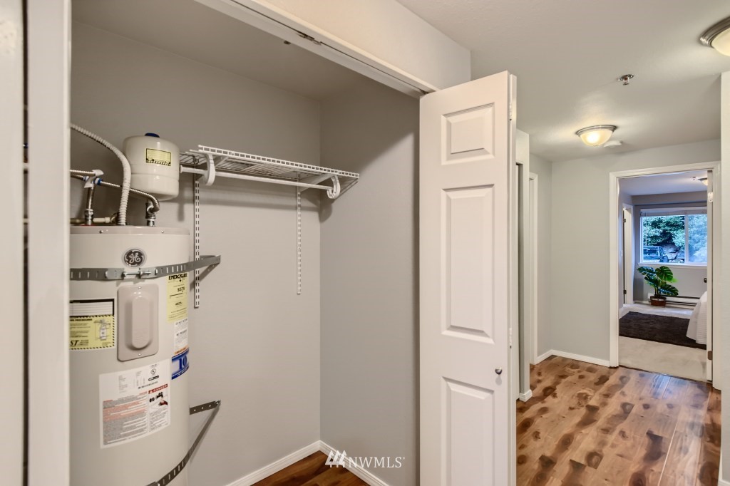 19410 Bothell Way Northeast, Unit D202 Bothell, WA 98011 - Photo 24 of 26 a bathroom with a sink and mirror