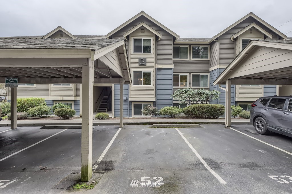 19410 Bothell Way Northeast, Unit D202 Bothell, WA 98011 - Photo 25 of 26 a car parked in front of a house