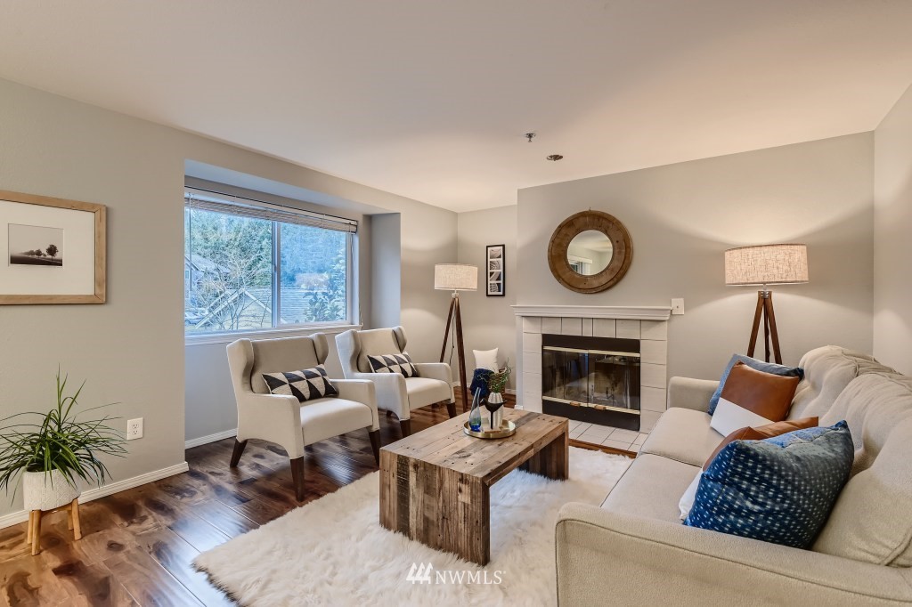 19410 Bothell Way Northeast, Unit D202 Bothell, WA 98011 - Photo 7 of 26 a living room with furniture and a fireplace
