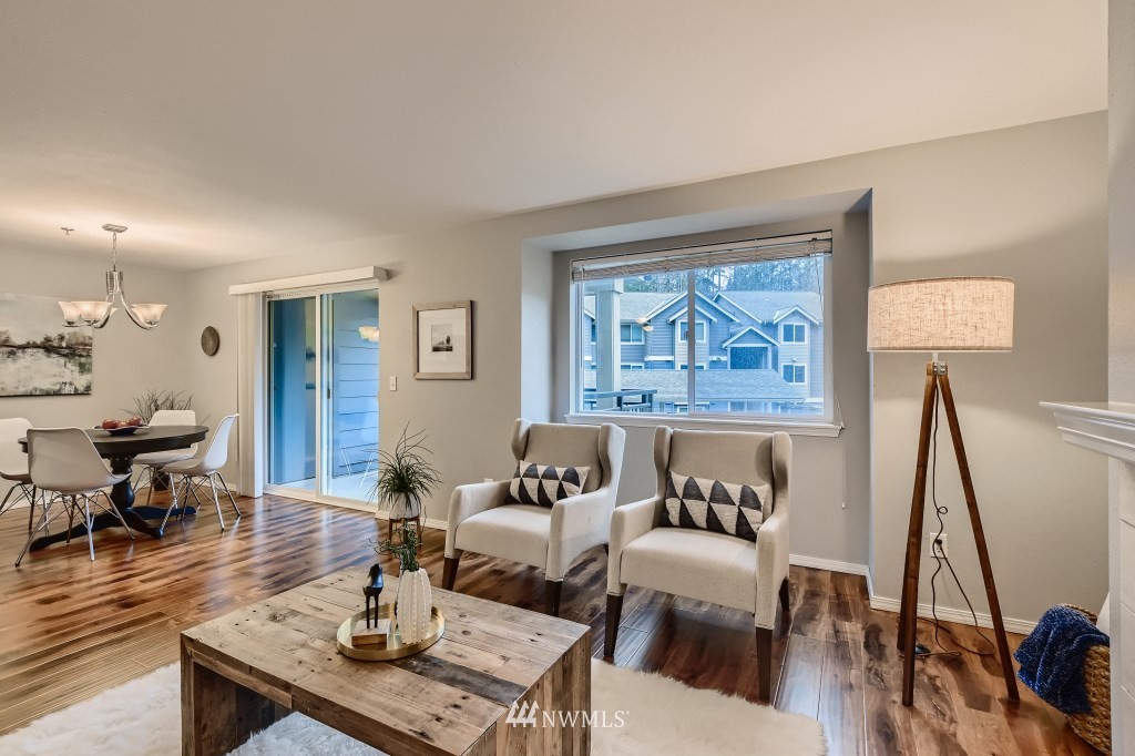19410 Bothell Way Northeast, Unit D202 Bothell, WA 98011 - Photo 9 of 26 a living room with furniture a rug and a large window