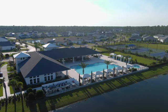 an aerial view of a house with a lake view