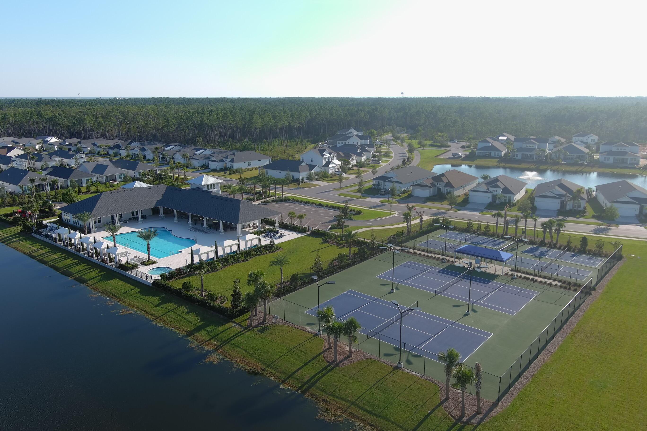 2332 Pathways Drive Watersound, FL 32461 - Photo 9 of 13 an aerial view of a house with a garden