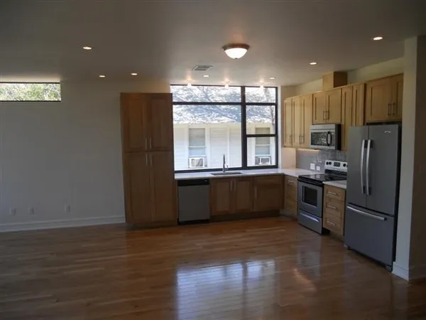 a large kitchen with a large window