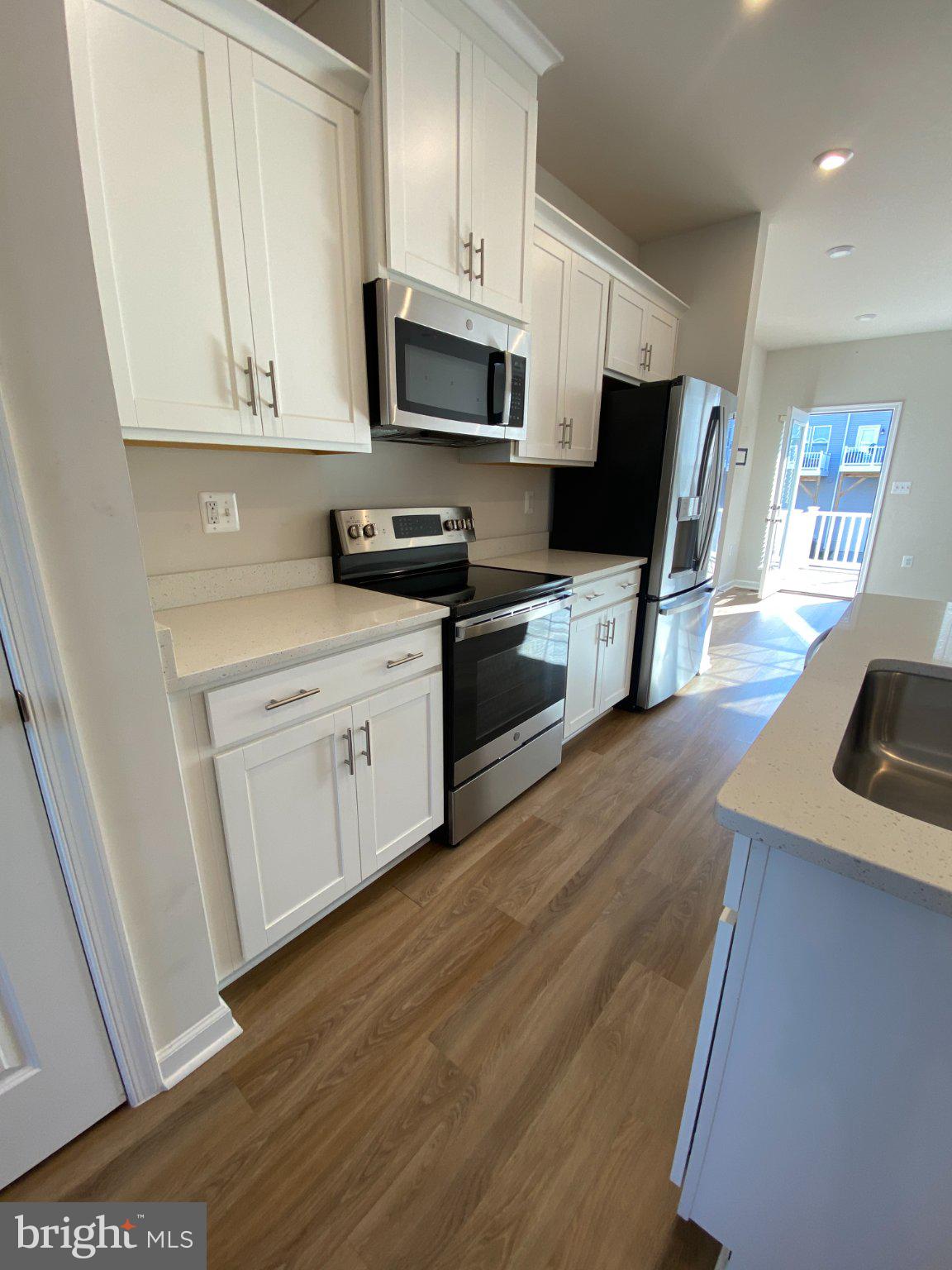 58 Coolidge Avenue Ranson, WV 25438 - Photo 9 of 30 Modern kitchen with sleek finishes.