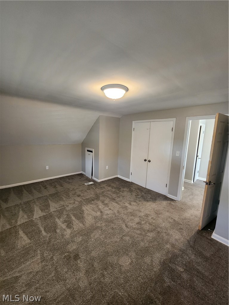 2199 North Taylor Road Cleveland Heights, OH 44112 - Photo 18 of 19 Bonus room with dark colored carpet and lofted ceiling