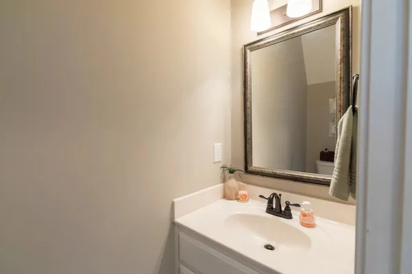 a bathroom with a sink and mirror