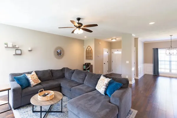 a view of a livingroom with furniture and a wooden floor